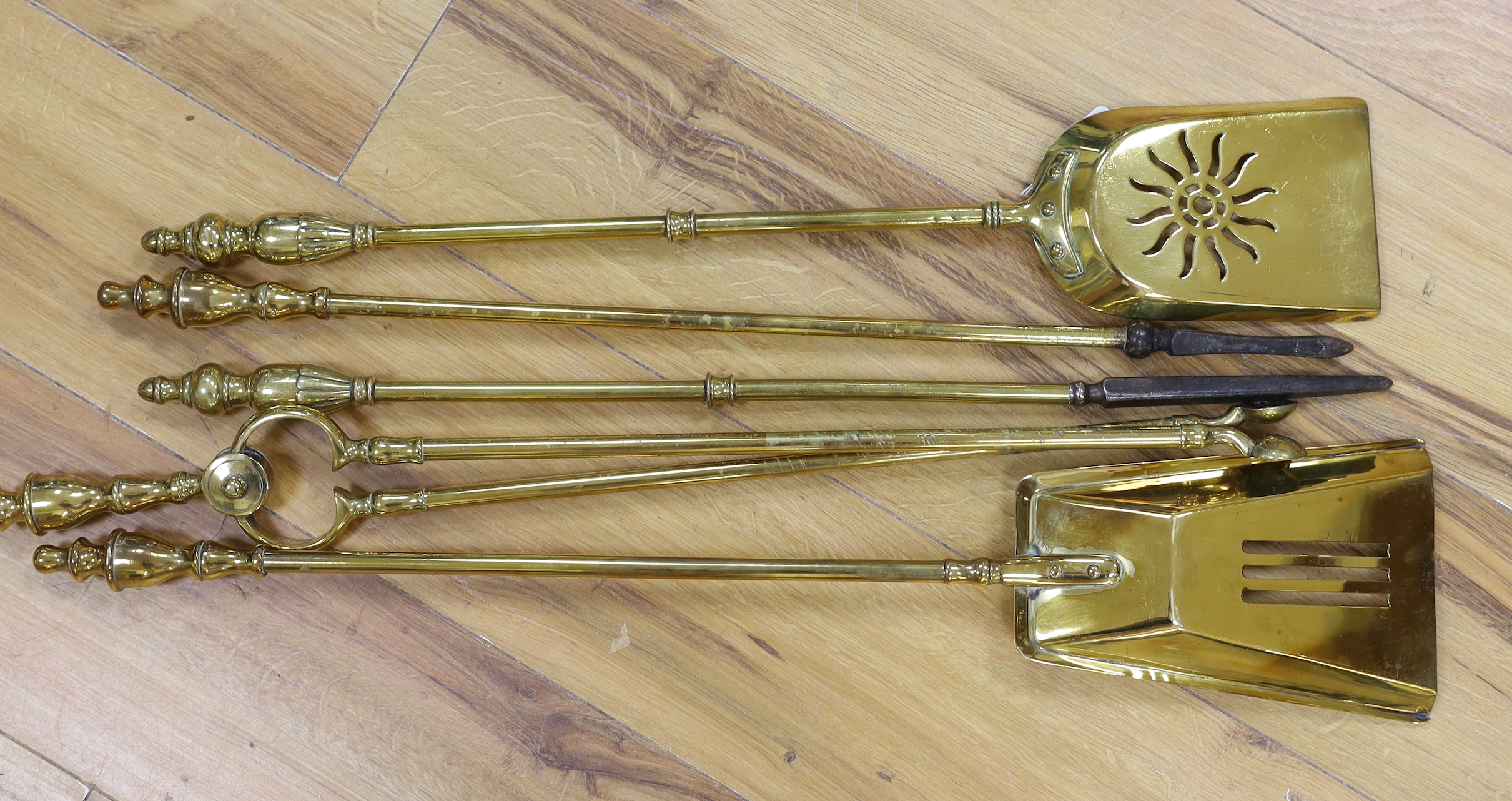 Brass five piece fire companion set, the largest 70cm in length